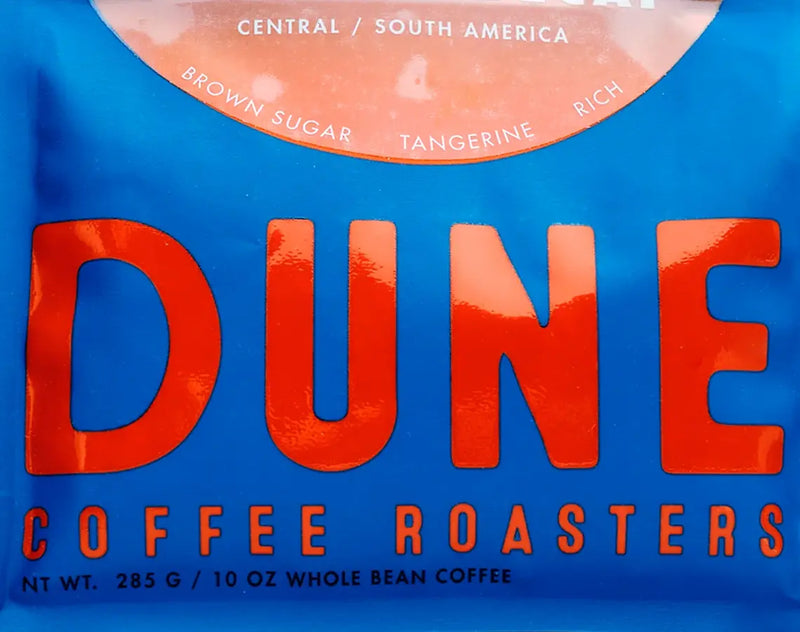 Dune Coffee Roasters package with blue background and red text